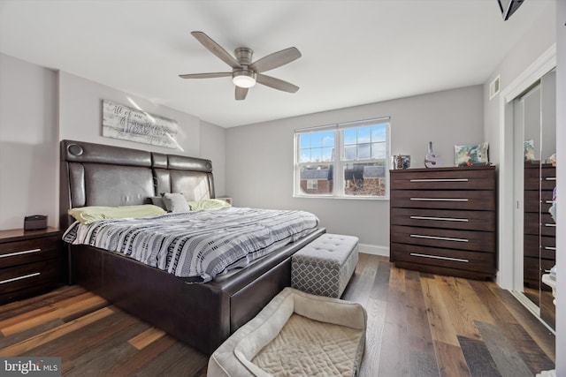 bedroom featuring ceiling fan, a closet, and wood-type flooring