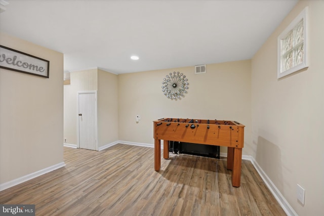 recreation room featuring light hardwood / wood-style floors