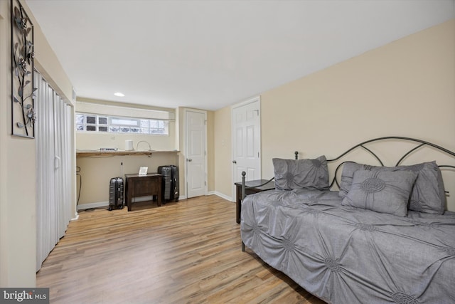 bedroom with light hardwood / wood-style flooring