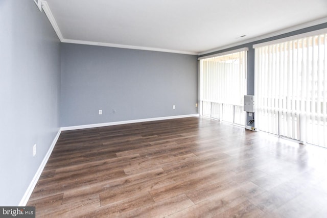 unfurnished room featuring hardwood / wood-style floors and ornamental molding