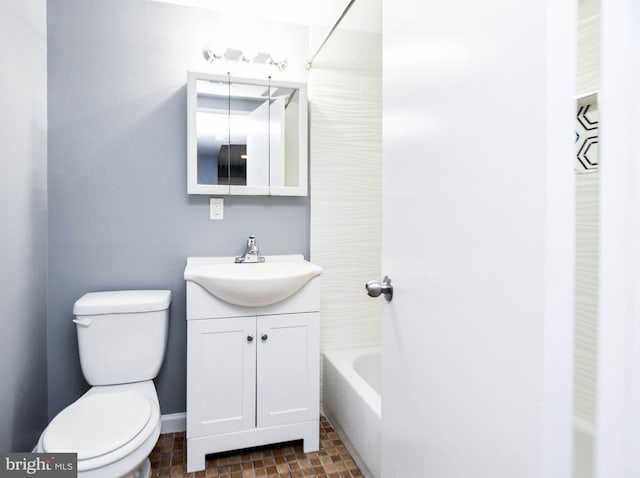 full bathroom with washtub / shower combination, vanity, and toilet