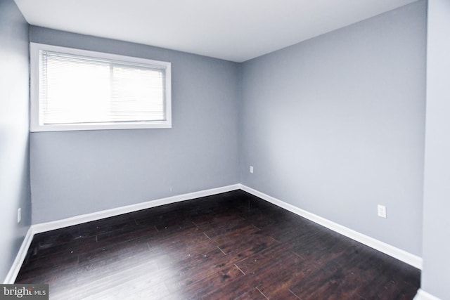 unfurnished room featuring hardwood / wood-style flooring