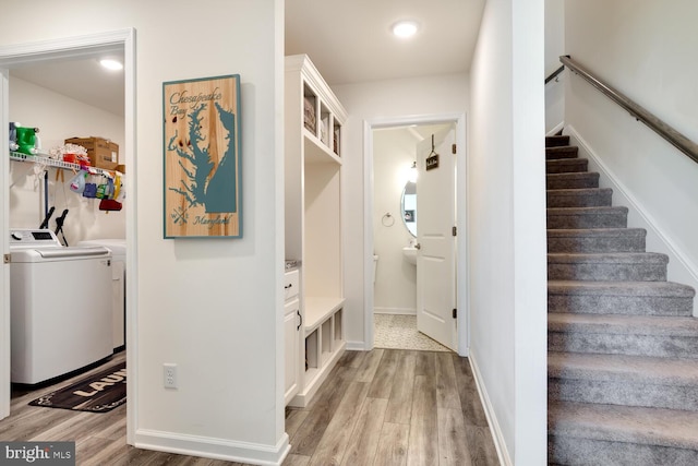 mudroom featuring washer and clothes dryer and light wood-type flooring