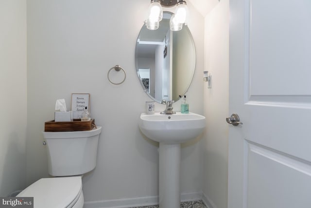 bathroom featuring sink and toilet