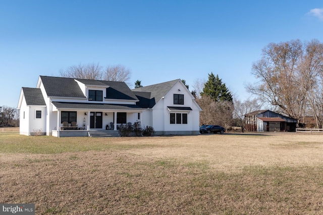 exterior space with a front lawn and a porch