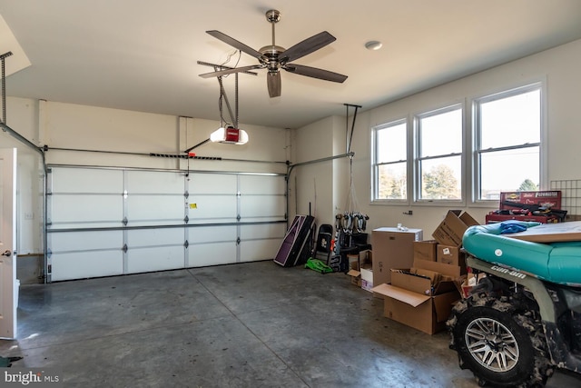 garage featuring ceiling fan and a garage door opener