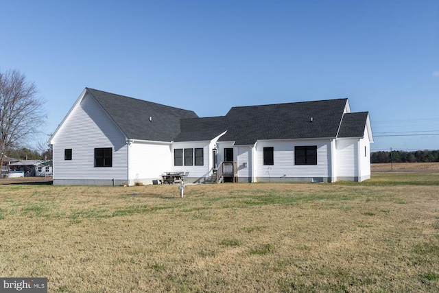 rear view of house with a lawn