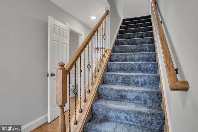 stairway with wood-type flooring