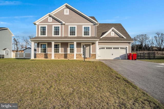 craftsman inspired home with a porch, central AC unit, a front lawn, and a garage