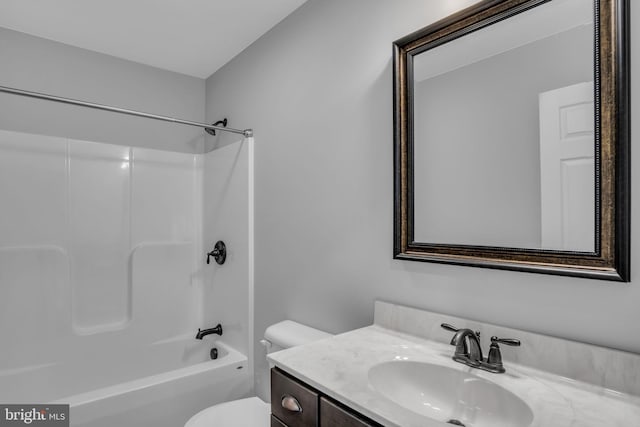 full bathroom with vanity,  shower combination, and toilet