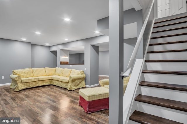 living room with dark hardwood / wood-style flooring