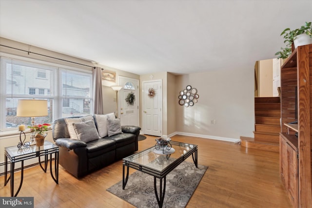 living room featuring light hardwood / wood-style floors and a baseboard radiator