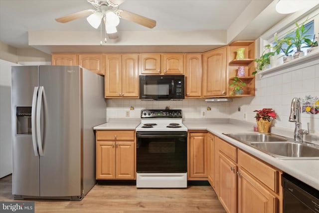 kitchen featuring sink, light brown cabinets, tasteful backsplash, light hardwood / wood-style floors, and black appliances