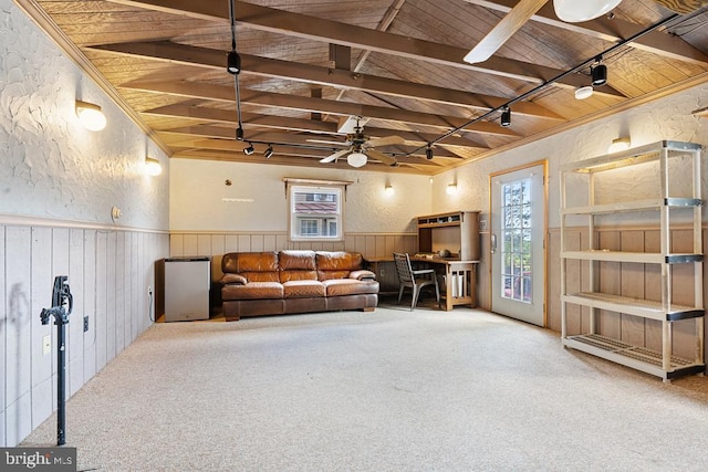 living room with carpet flooring, ceiling fan, lofted ceiling with beams, and wood ceiling