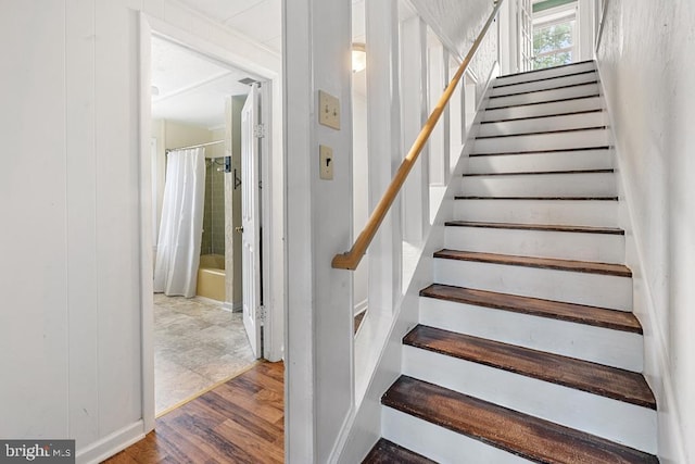 stairs with wood-type flooring