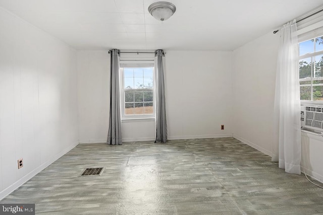 unfurnished room with light hardwood / wood-style flooring