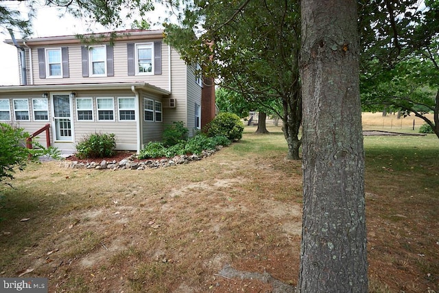 view of home's exterior featuring a yard