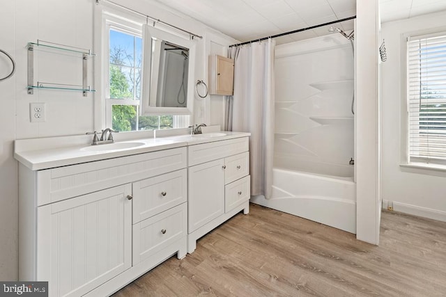 bathroom featuring shower / tub combo, vanity, and hardwood / wood-style flooring