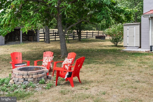 view of yard with a fire pit