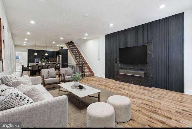 living room with light hardwood / wood-style flooring