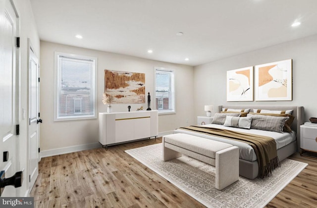 bedroom with light hardwood / wood-style floors