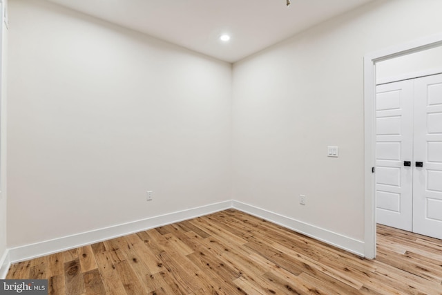 empty room with light hardwood / wood-style floors