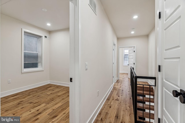 hall with light hardwood / wood-style flooring