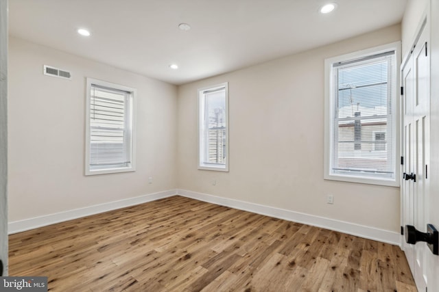 unfurnished room with plenty of natural light and light wood-type flooring