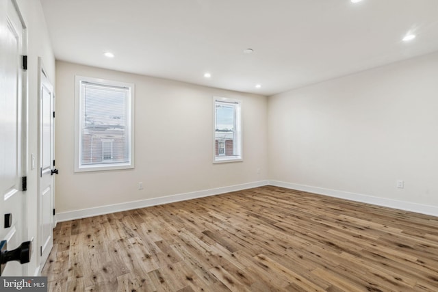 spare room featuring light hardwood / wood-style floors