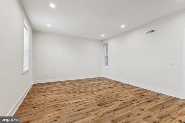 unfurnished room featuring hardwood / wood-style floors