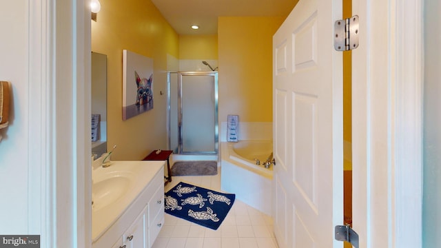 bathroom featuring tile patterned floors, vanity, and plus walk in shower