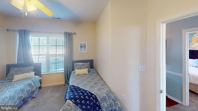 carpeted bedroom featuring ceiling fan