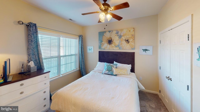 bedroom with ceiling fan, a closet, and carpet