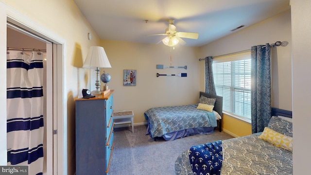 carpeted bedroom with ceiling fan