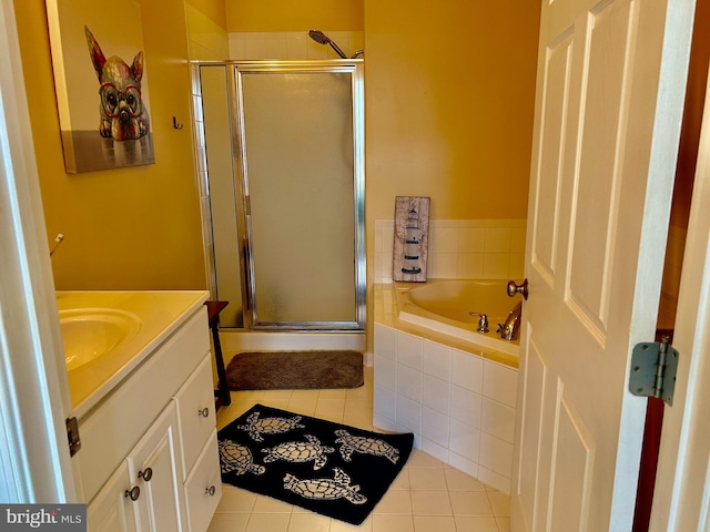 bathroom with separate shower and tub, vanity, and tile patterned flooring