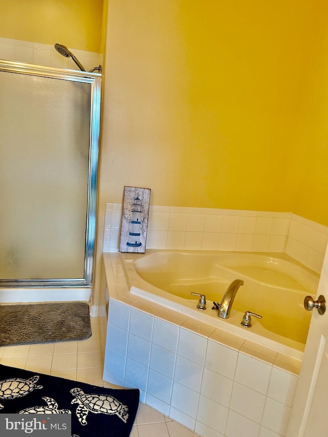 bathroom featuring separate shower and tub and tile patterned flooring