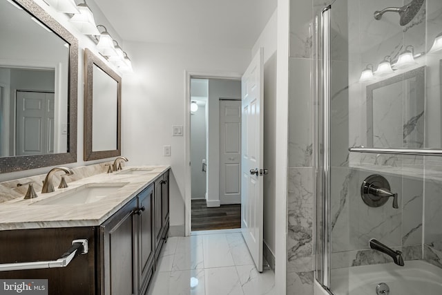 bathroom featuring vanity and tiled shower / bath combo