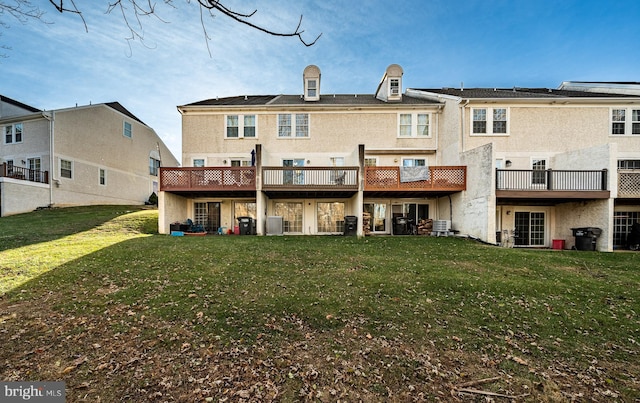 back of house with a yard and central air condition unit