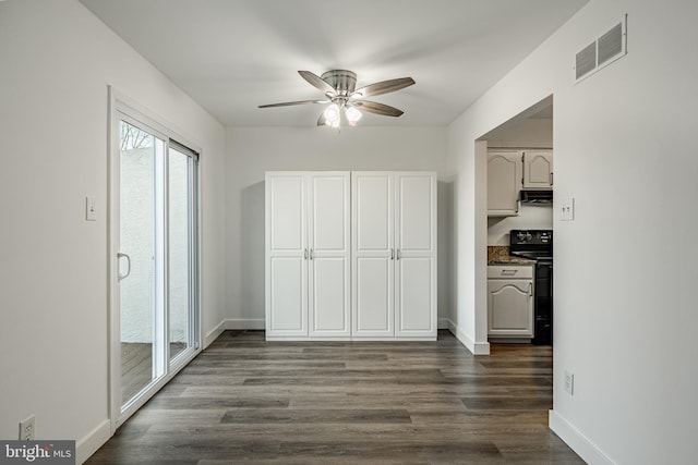 corridor featuring hardwood / wood-style floors