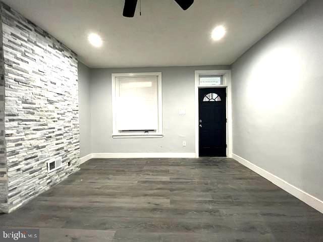 entrance foyer featuring dark hardwood / wood-style floors and ceiling fan