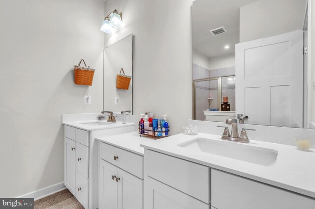 bathroom with vanity and an enclosed shower