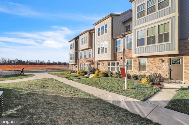 exterior space with a front lawn