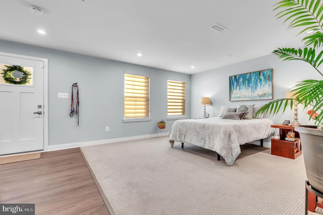 bedroom with hardwood / wood-style flooring