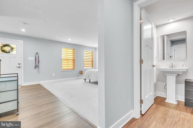 interior space with light hardwood / wood-style floors and plenty of natural light