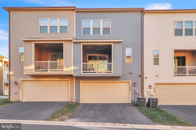 view of property with a balcony and central AC