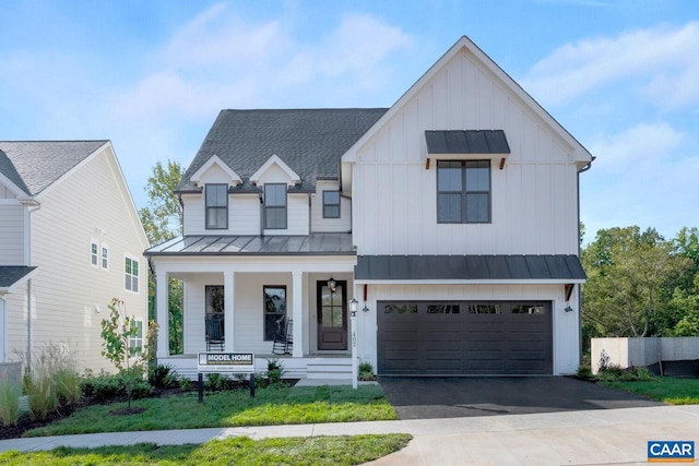 modern farmhouse style home with covered porch and a garage