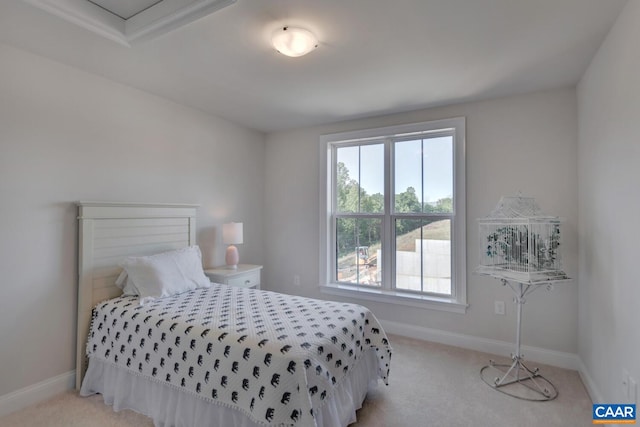 bedroom featuring light carpet and crown molding