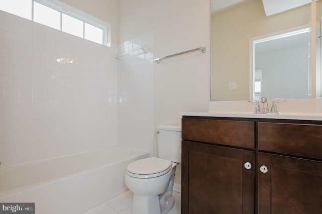 bathroom with  shower combination, vanity, toilet, and tile patterned floors