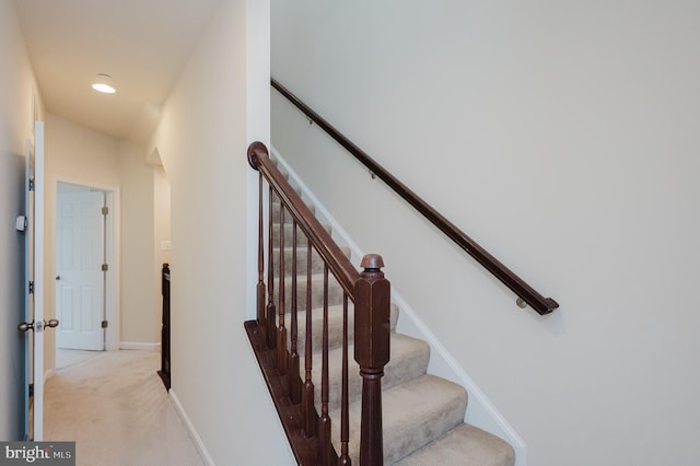 stairway featuring recessed lighting, carpet flooring, and baseboards