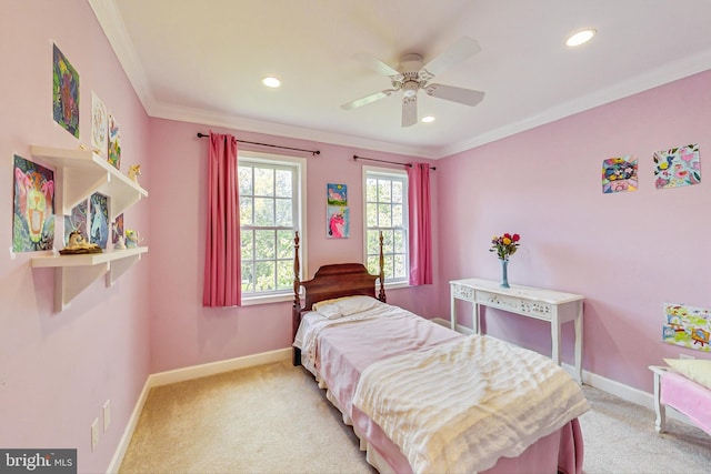 bedroom with light colored carpet, ceiling fan, and crown molding